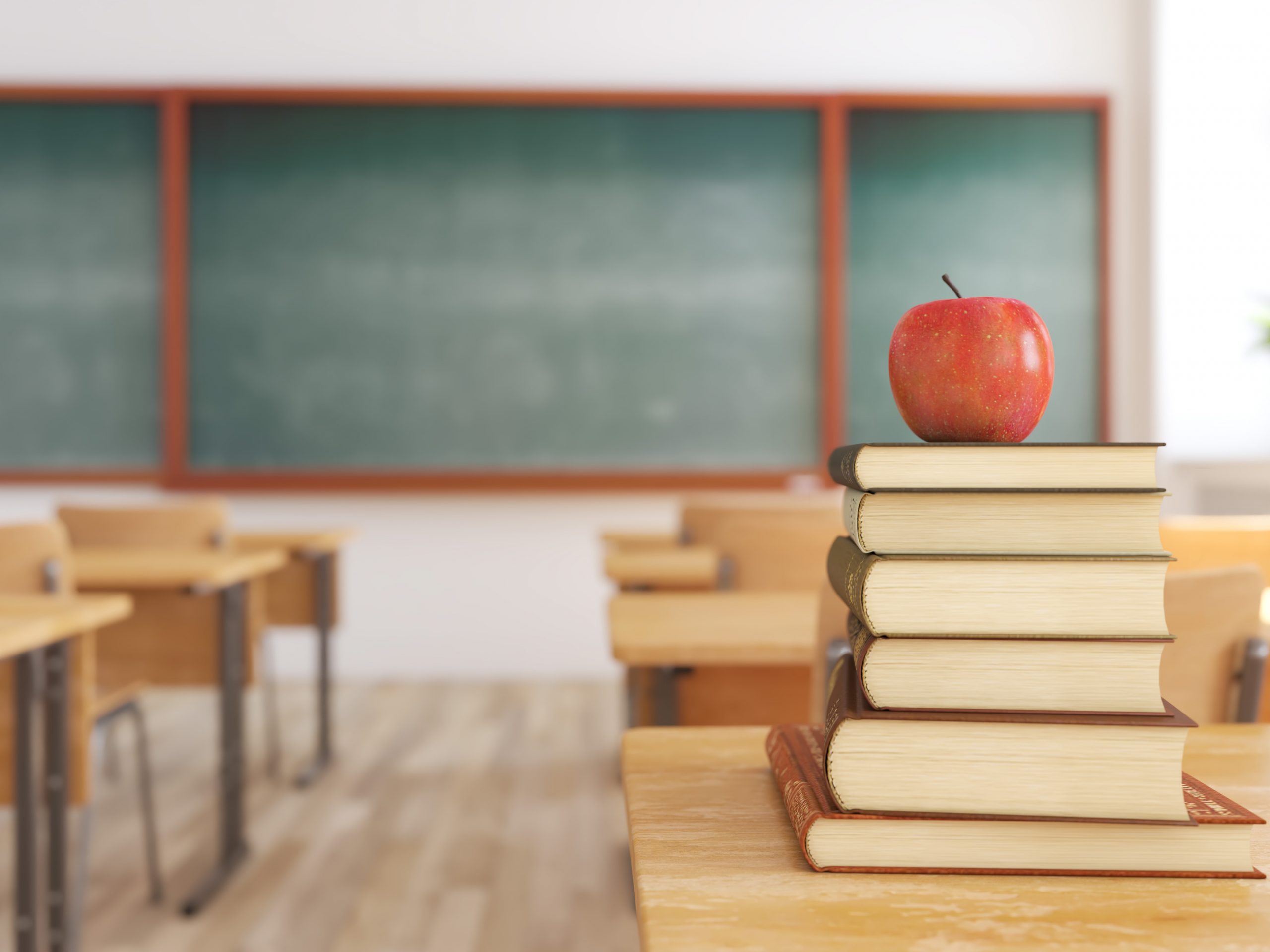 3d rendering. one apple on books in empty school classroom. education concept