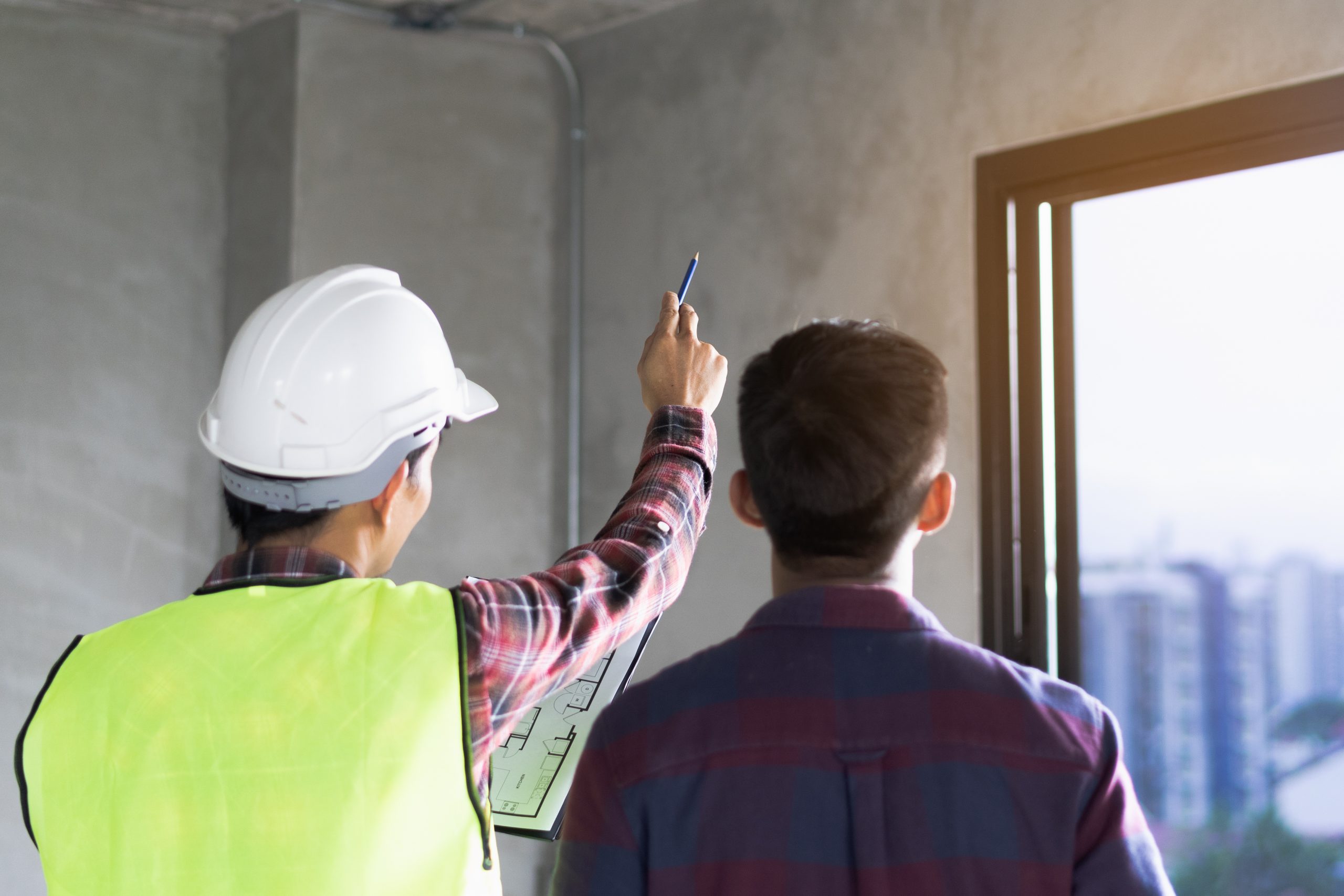 Client and inspector discussing possible issues with a house