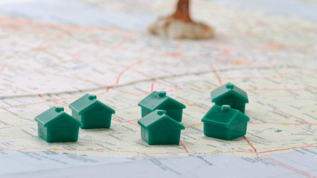 tiny toy homes sitting on a map
