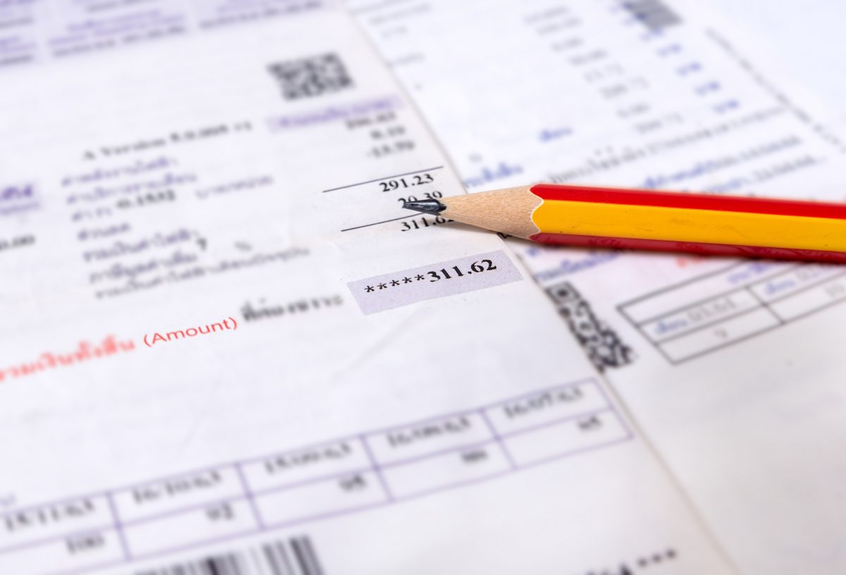 Utility energy bill with pencil blurred background Utility energy bill with pencil blurred background, Bill and saving concept