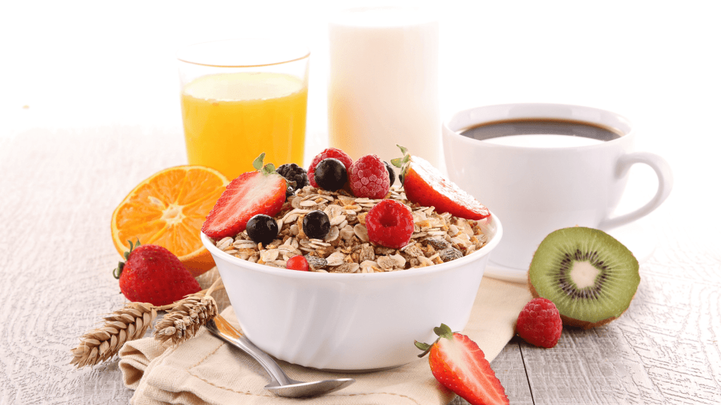 Healthy Breakfast with fresh fruits, juice, milk, oats