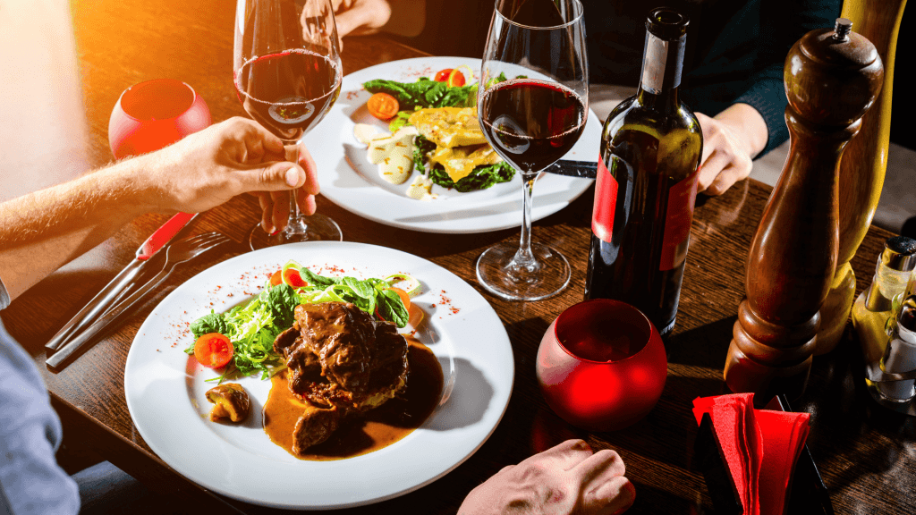 Food plated at table with wine