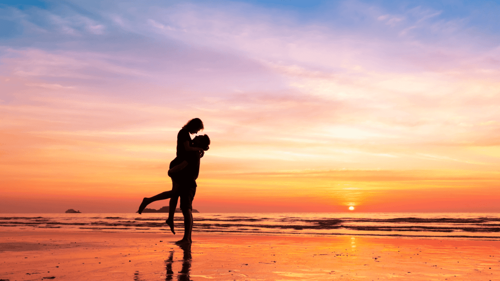 Couple on a beach at sunset