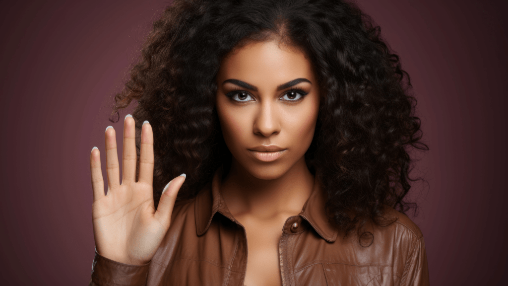 woman with serious face holding hands up