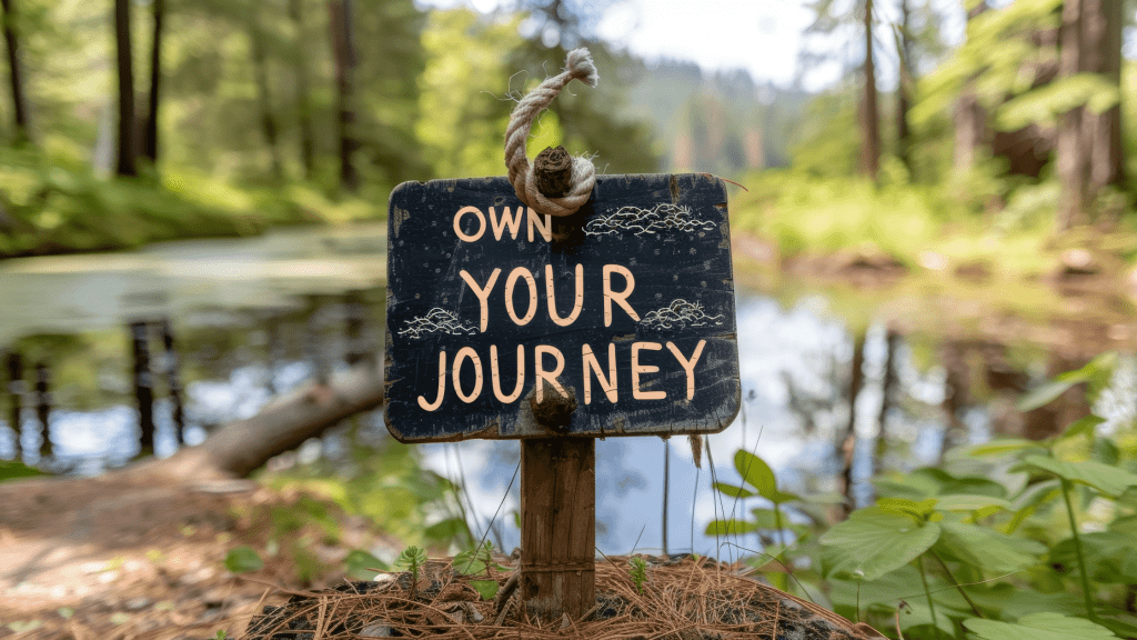 own your journey sign near water in a forest