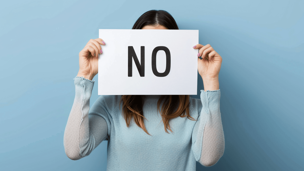 woman holding sign saying NO